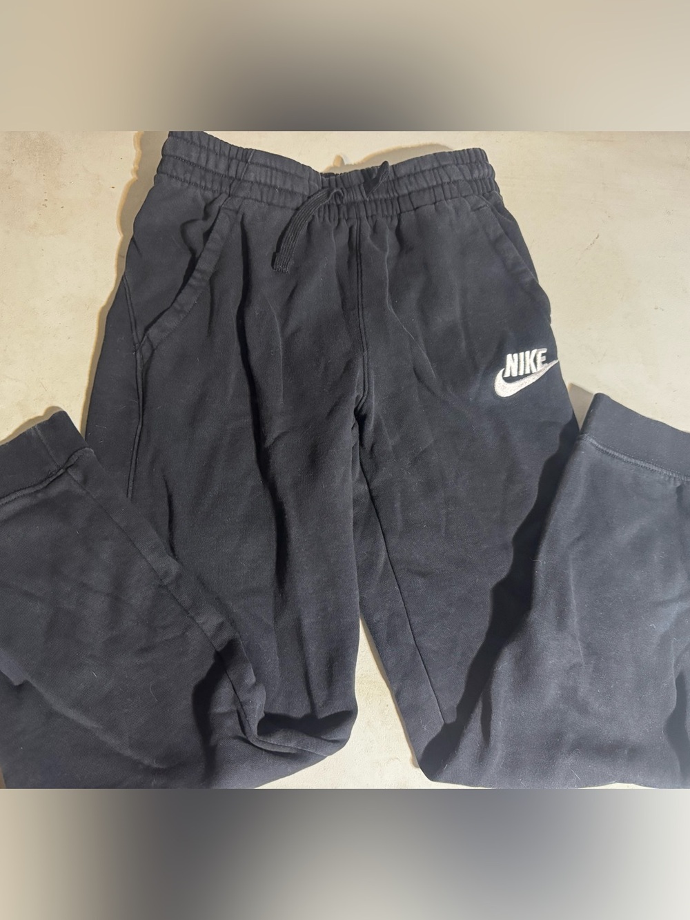 Nike Kids Black Sweatpants with White Swoosh